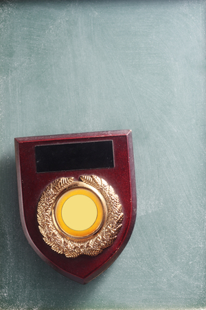 close of the badge or trophy on the blackboardの写真素材
