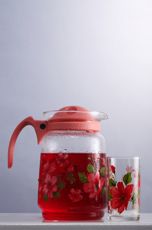 cold rose syrup drink in the water pitcherの写真素材