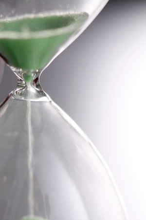 Sand funneling through hour glass