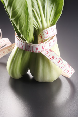 Lettuce Wrapped With Measuring Tapeの写真素材