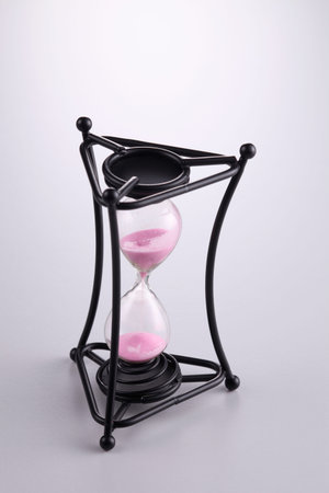 full length of hourglass draining sand