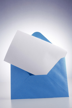 blank paper insert into the envelopeの写真素材
