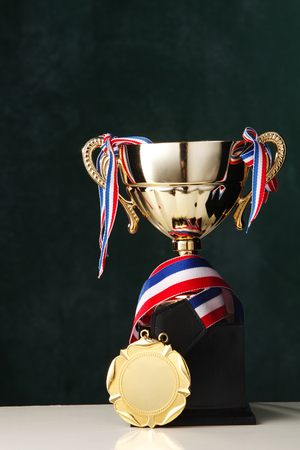 close up of the trophy in front of blackboardの写真素材