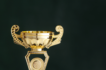close up of the trophy in front of blackboardの写真素材