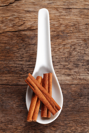 cinnamon stick on the wooden backgroundの写真素材