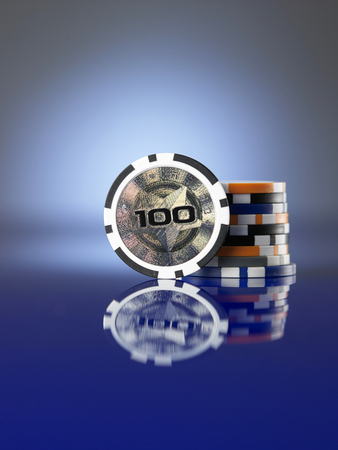 hundred dollar chips on the blue backgroundの写真素材