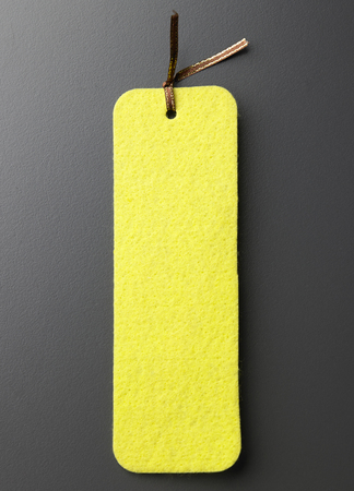 yellow color price tag on the gray backgroundの写真素材