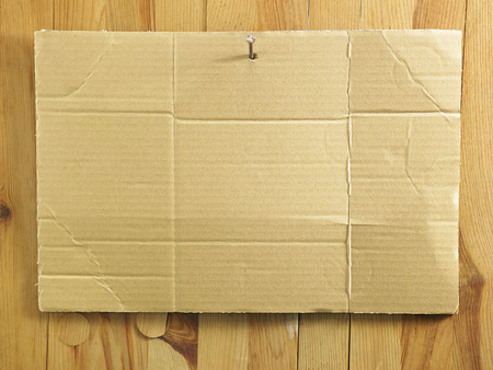 blank cardboard on the wallの写真素材