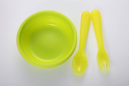 yellow plastic bowl on the white backgroundの写真素材