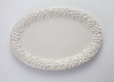 oval shaped plate on the white backgroundの写真素材