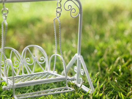 close up of the toy swing