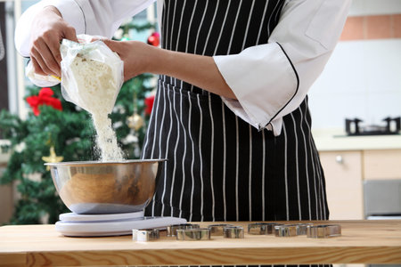 pouring flour to the mixerの写真素材