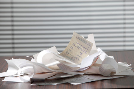stack of the receipt on the table