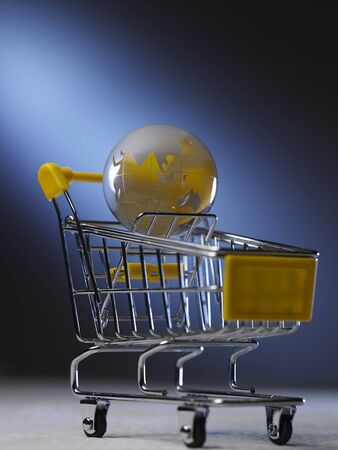 glass globe on the mini shopping cartの写真素材
