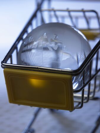 glass globe on the mini shopping cartの写真素材