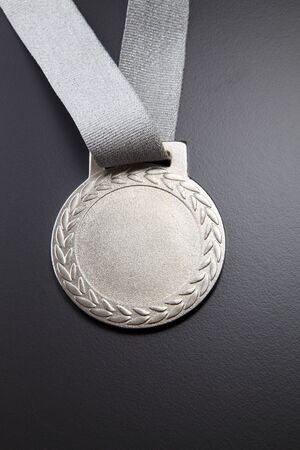 silver mmedal on the gray backgroundの写真素材