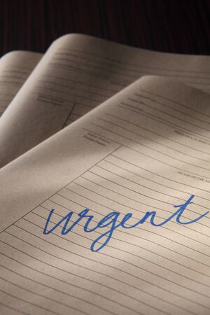 stacks of urgent brown paper filesの写真素材