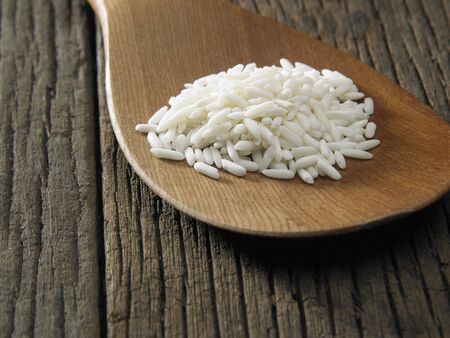 Glutinous rice on the wooden spoonの写真素材