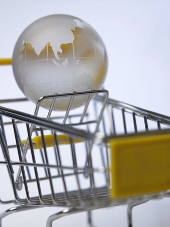 glass globe on the mini shopping cartの写真素材