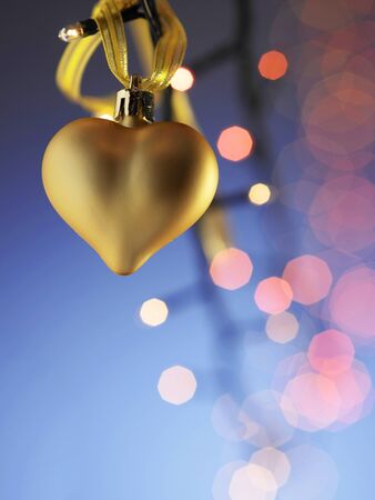 gold heart shaped christmas ornammentの写真素材