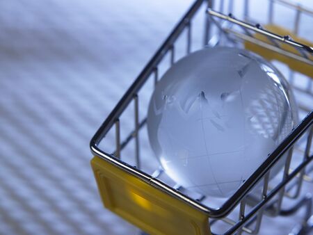 glass globe on the mini shopping cartの写真素材