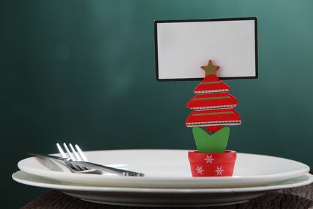 handmade christmas tree holding blank cardの写真素材