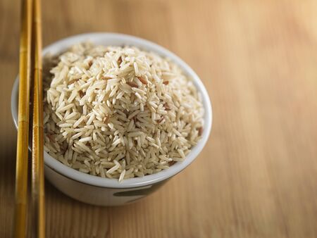 brown rice in the bowlの写真素材