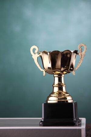 trophy in front of the blackboardの写真素材