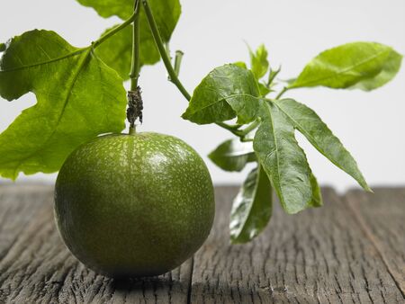 Close up of passion fruit on the vineの写真素材