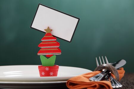 handmade christmas tree holding blank cardの写真素材