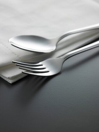 table setting fork and spoon on the napkinの写真素材