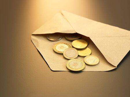 coins from the brown envelopeの写真素材