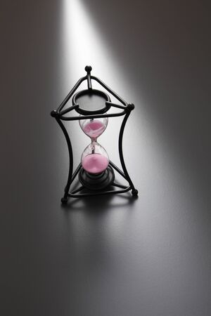 hour glass on the gray backgroundの写真素材