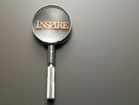 magnifying glass focus on alphabet inspireの写真素材