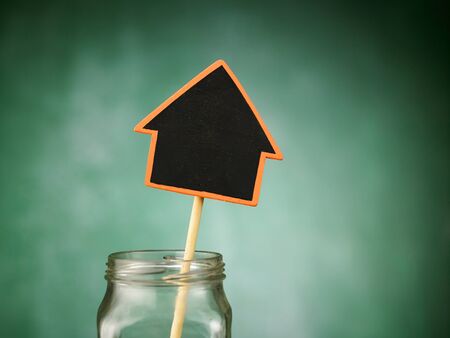 jar with black board house shapedの写真素材