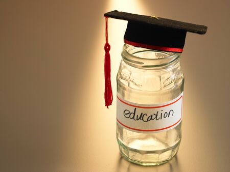 mortar board on the saving jarの写真素材