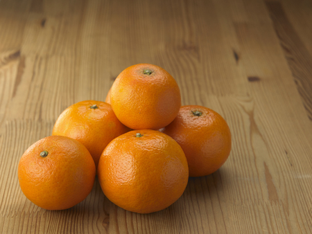 close up of the tangerine on the wooden backgroundの写真素材