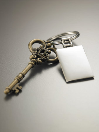 old key with blank silver tag