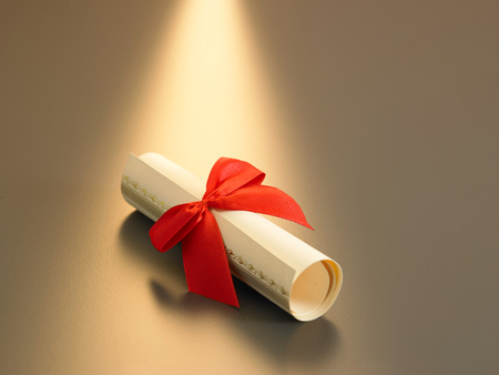 roll up certificate with red ribbonの写真素材