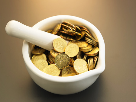 coin inside the kitchenware mortarの写真素材