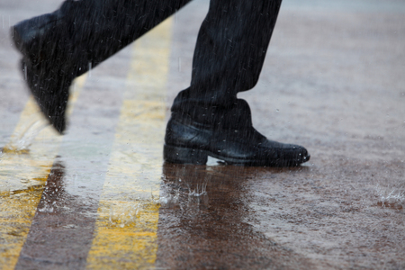 close up of man running in the rainの写真素材