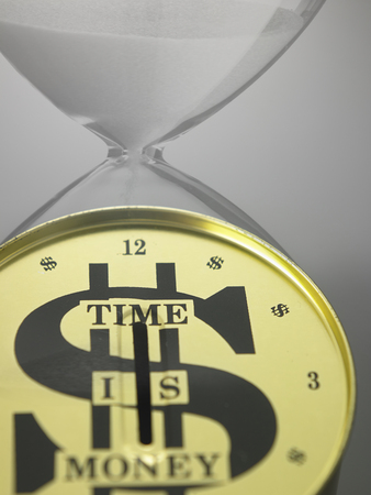 hour glass and the saving canの写真素材