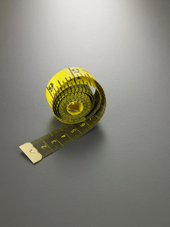 measuring tape on the gray background