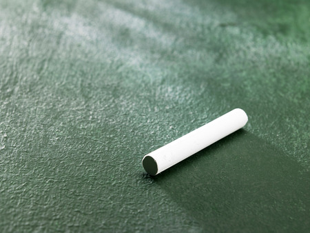 white color chalk on the black boardの写真素材