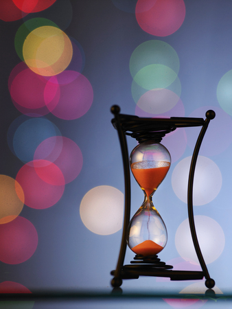 hour glass with beautiful light as backgroundの写真素材