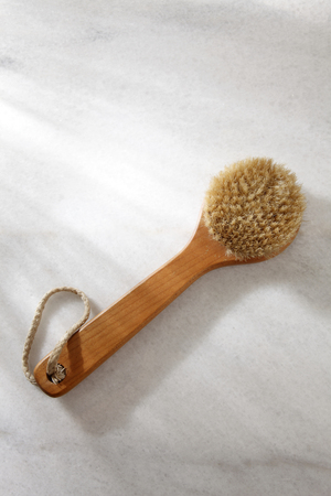top view of bathroom brush on top of marbleの写真素材