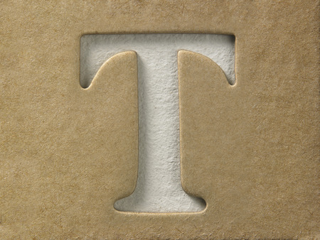 cut out alphabet t on the brown cardboardの写真素材