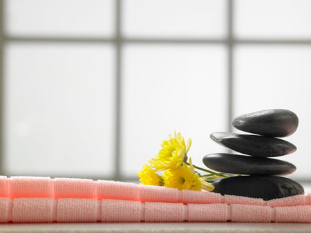 stack of stone and flower by the side