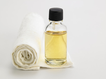 bottle of the massage oil on the face towelの写真素材