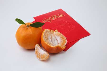chinese new year celebration mandarin orange with ang paoの写真素材
